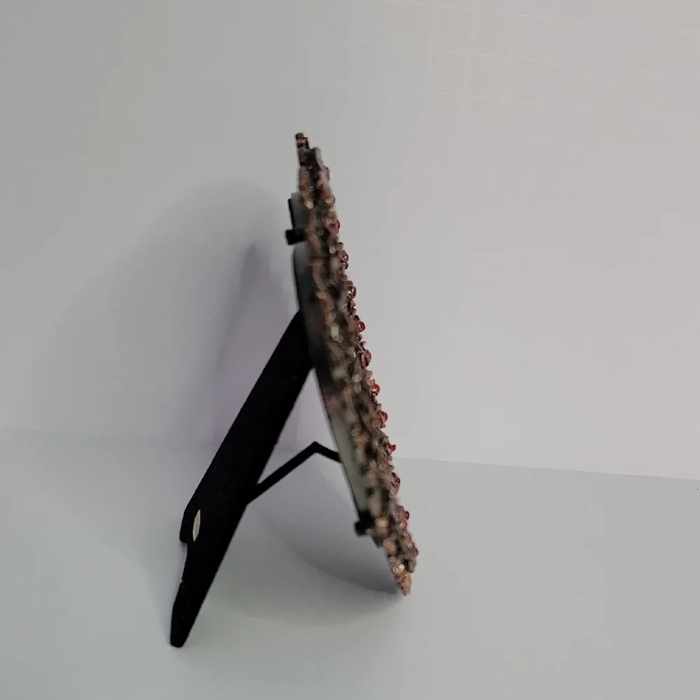 Heart-Shaped Bronze Frame with Red Accents